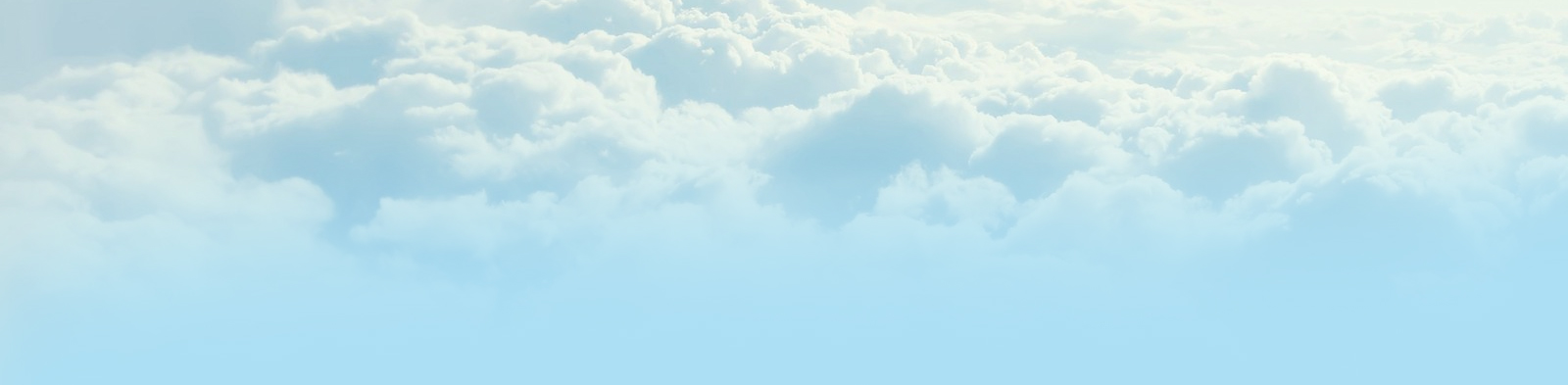 Soft blue sky with fluffy white clouds, calm and airy mood